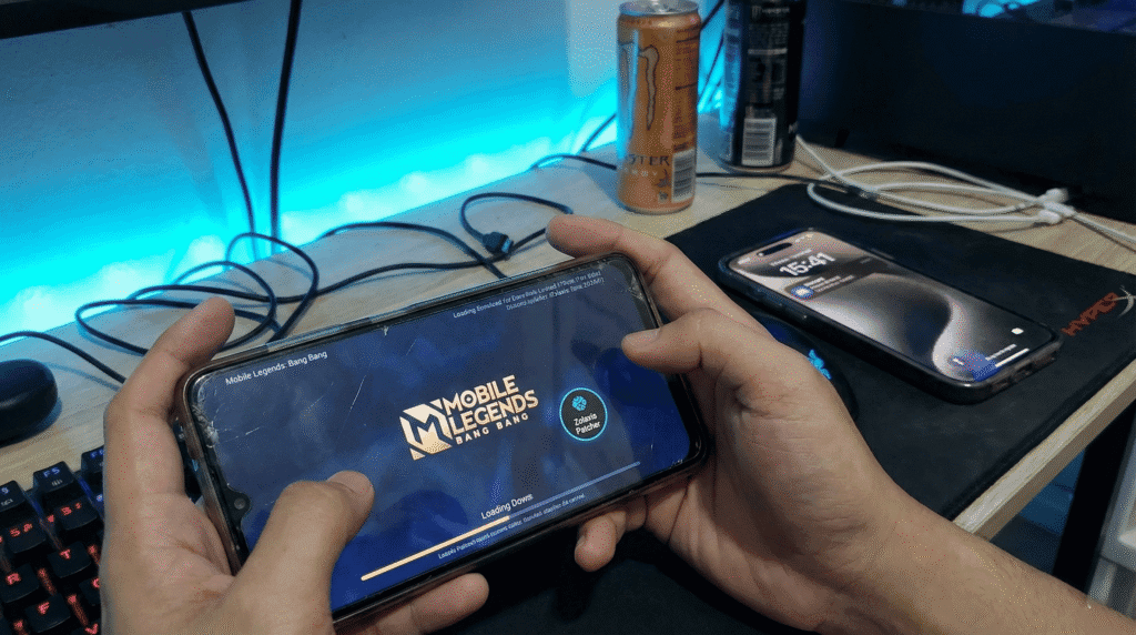 Gamer using a secondary Android phone for Zolaxis Patcher while keeping iPhone for personal use.